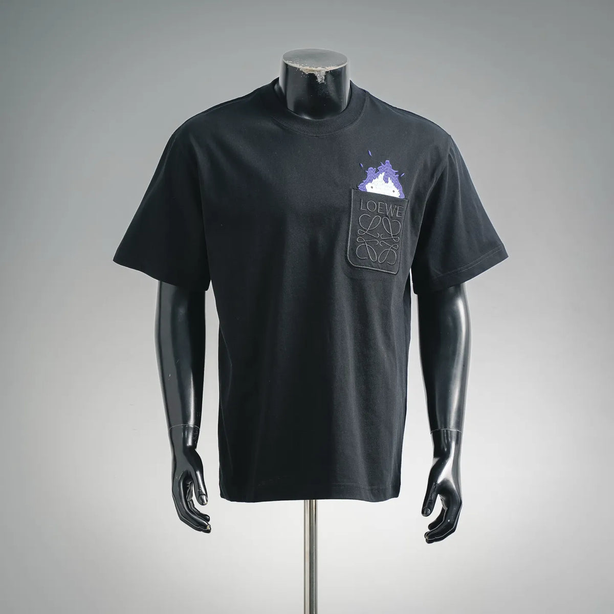 Black short-sleeve T-shirt with mock neck and small chest graphic pocket