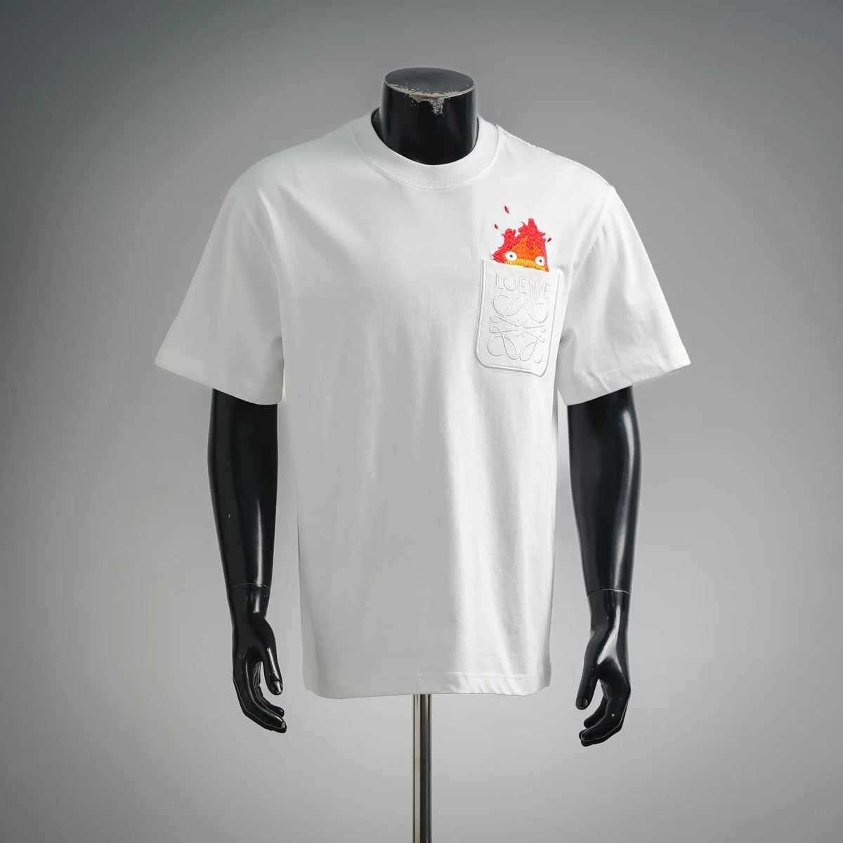 White short-sleeve T-shirt with LOEWE pocket graphic featuring red/orange monster