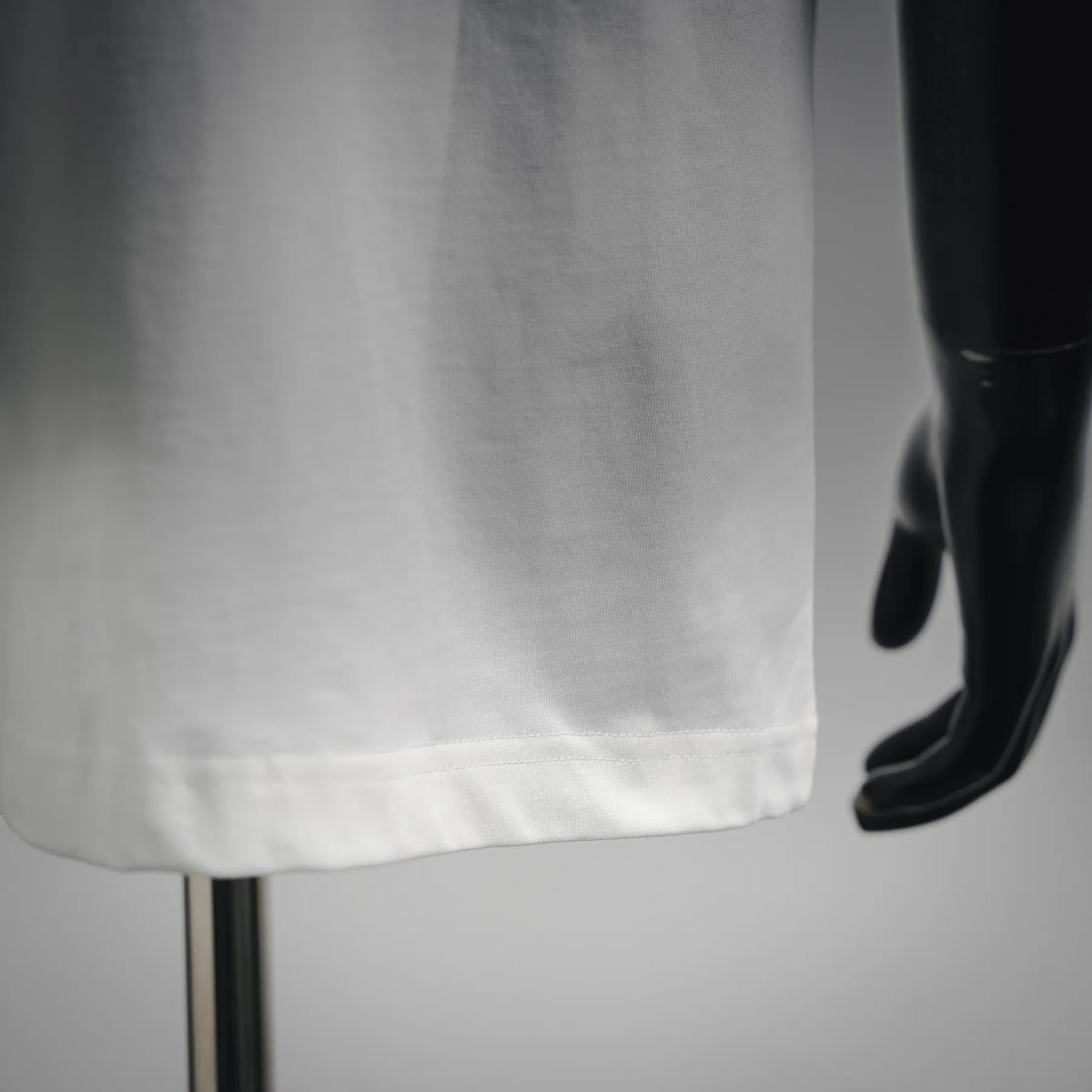 White T-shirt hem with stitched edge detail