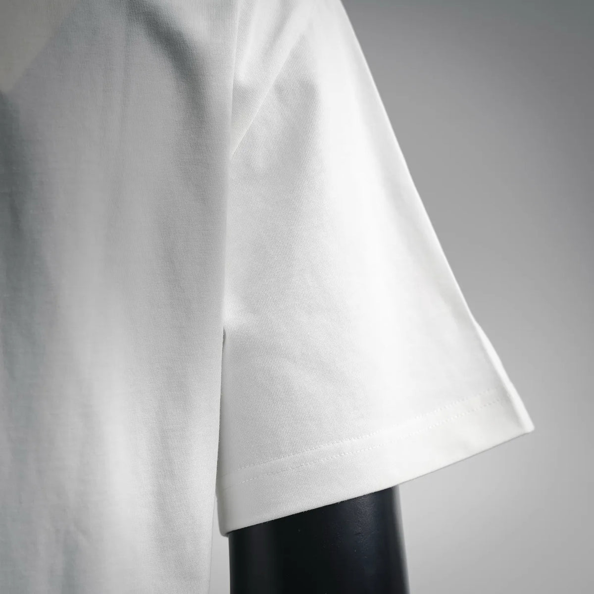 White T-shirt side seam and short sleeve hem