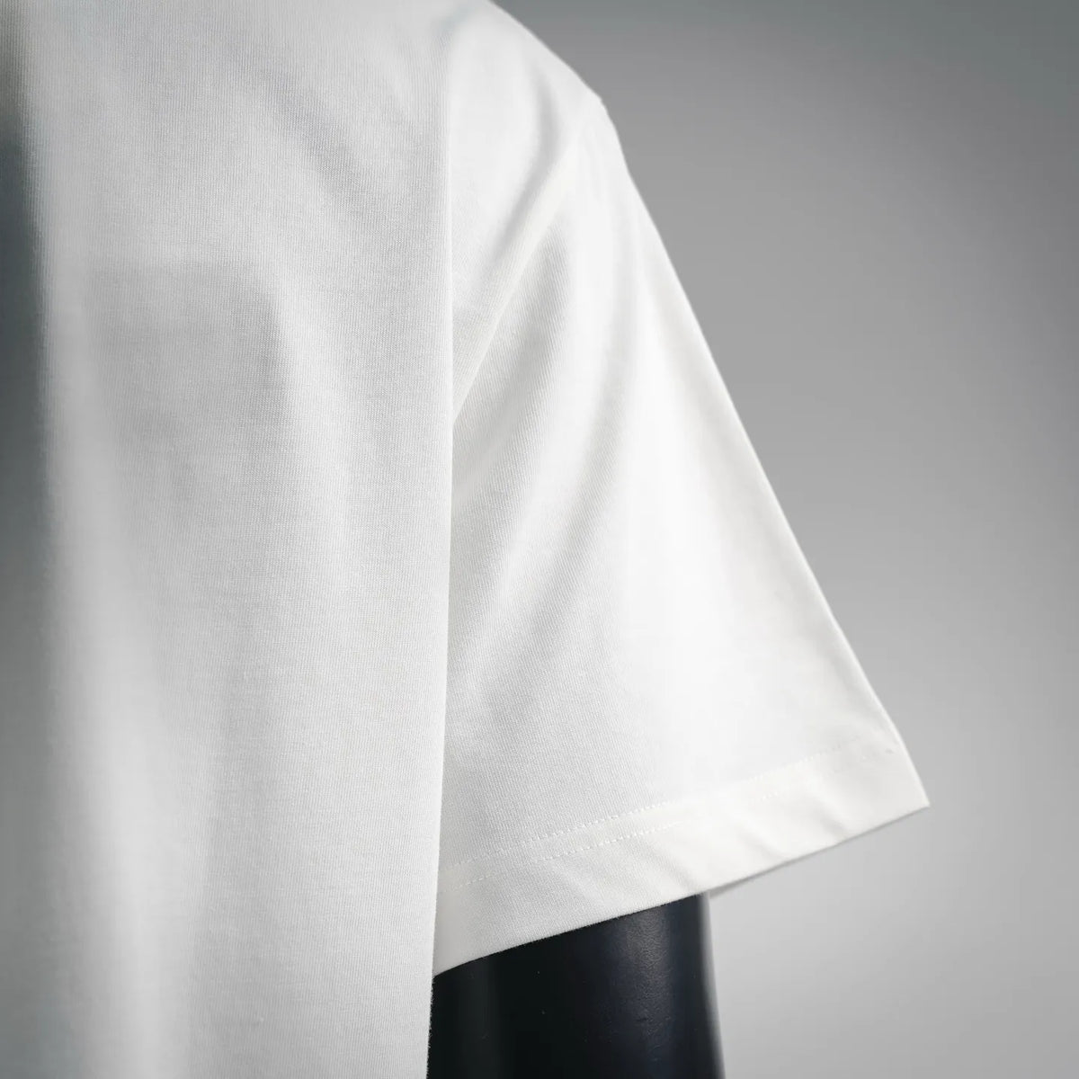 White T-shirt short sleeve and side seam detail; smooth jersey knit