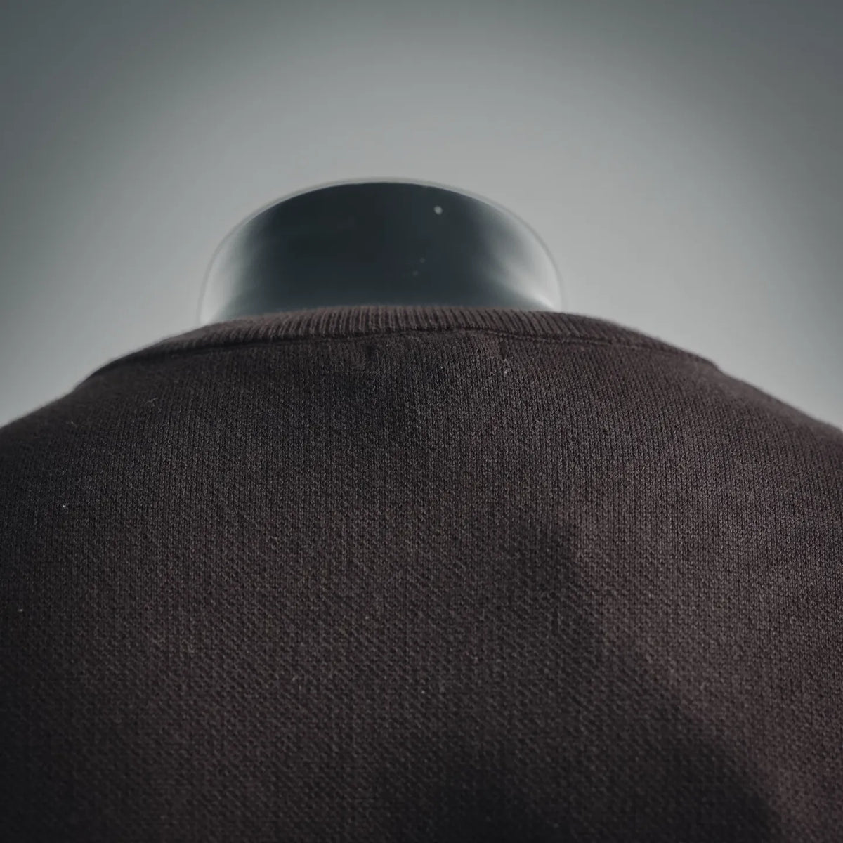 Back view of LOEWE short-sleeve shirt in dark gray/black knit fabric