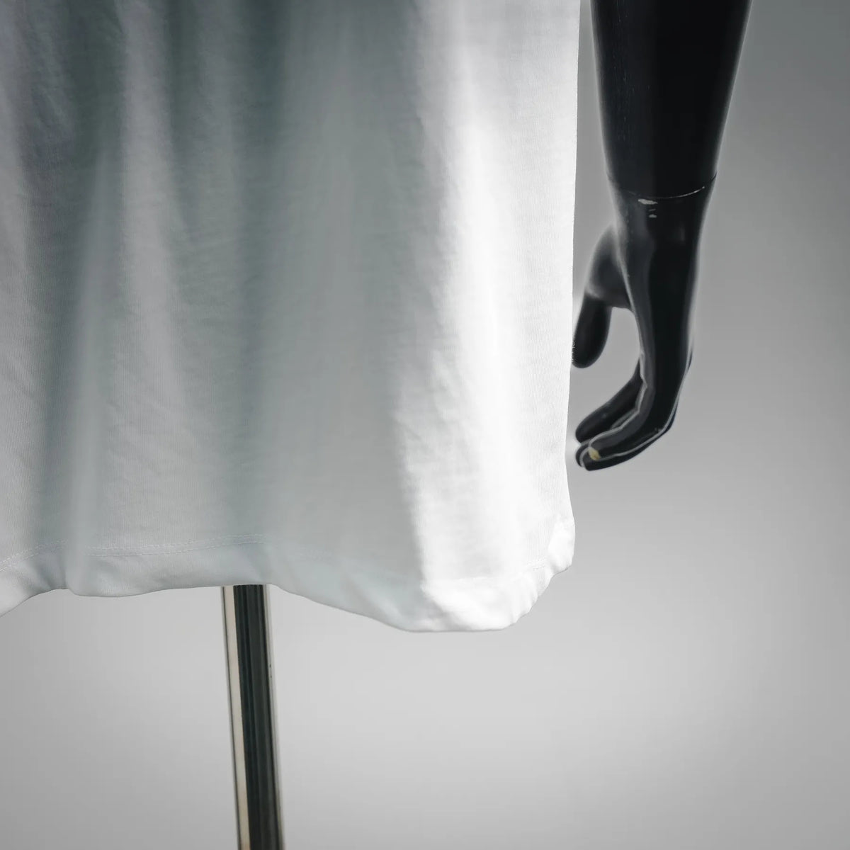 White T-shirt hem and side drape with visible short sleeve opening
