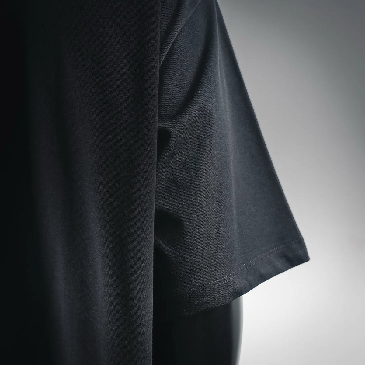 LOEWE black short-sleeve T-shirt sleeve and hem detail