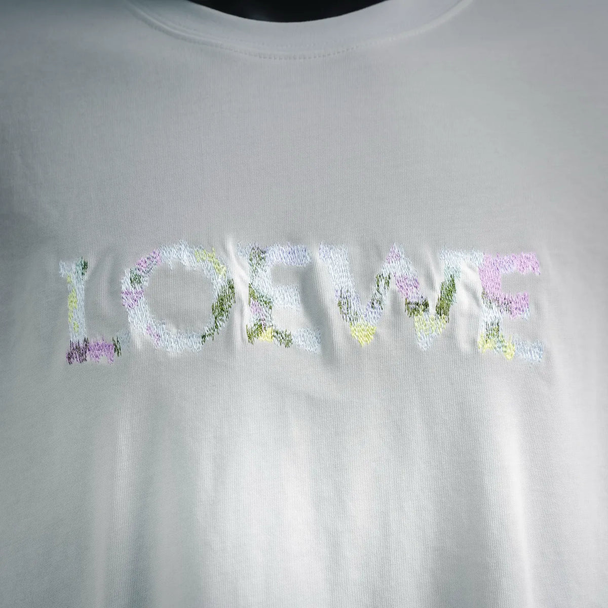 White T-shirt chest graphic print in multicolor letters