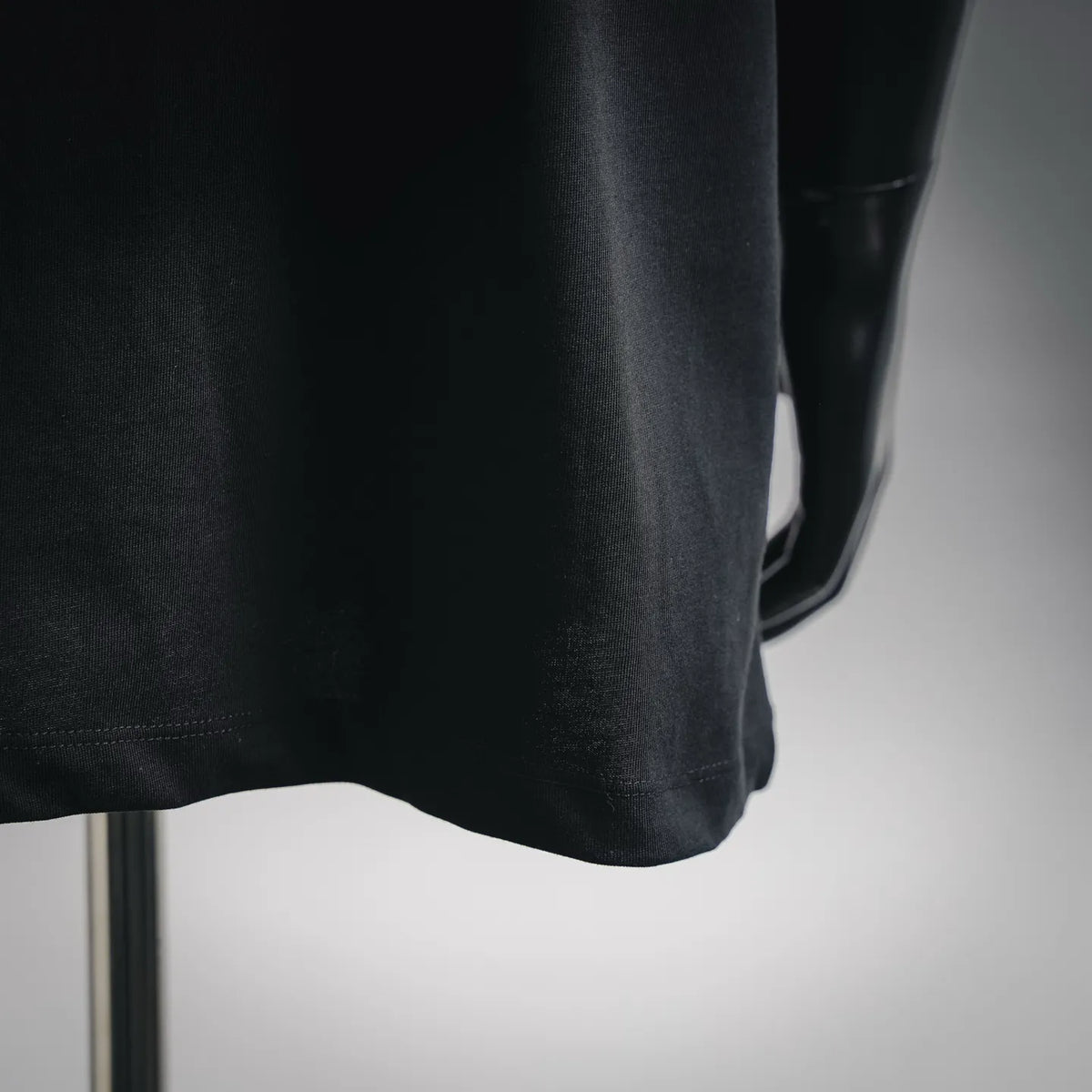 Black T-shirt lower hem with double stitching detail