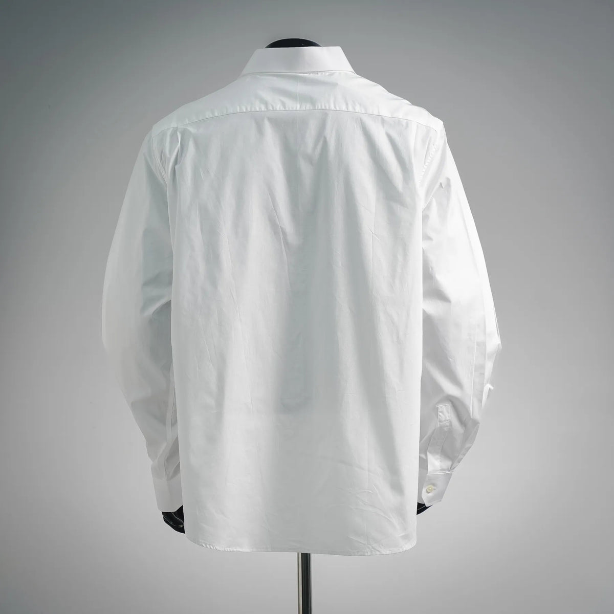 White long-sleeve dress shirt, back view with yoke and buttoned cuffs
