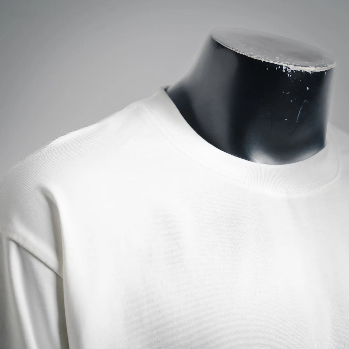 LOEWE white long-sleeve crewneck T-shirt neckline close-up