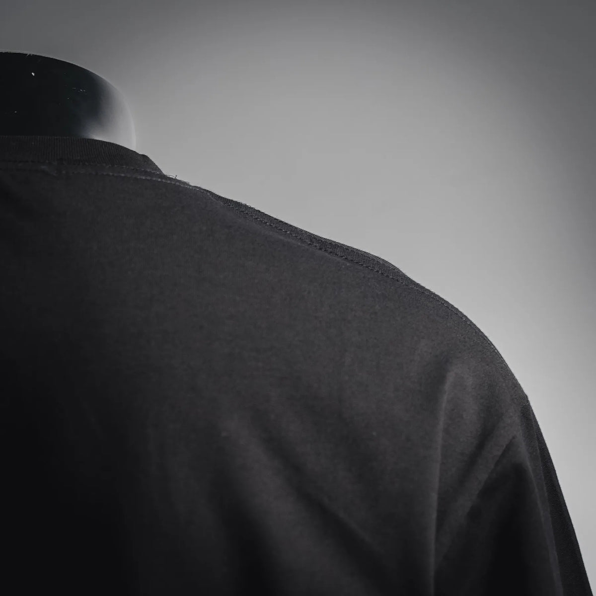 Black shirt sleeve seam close-up