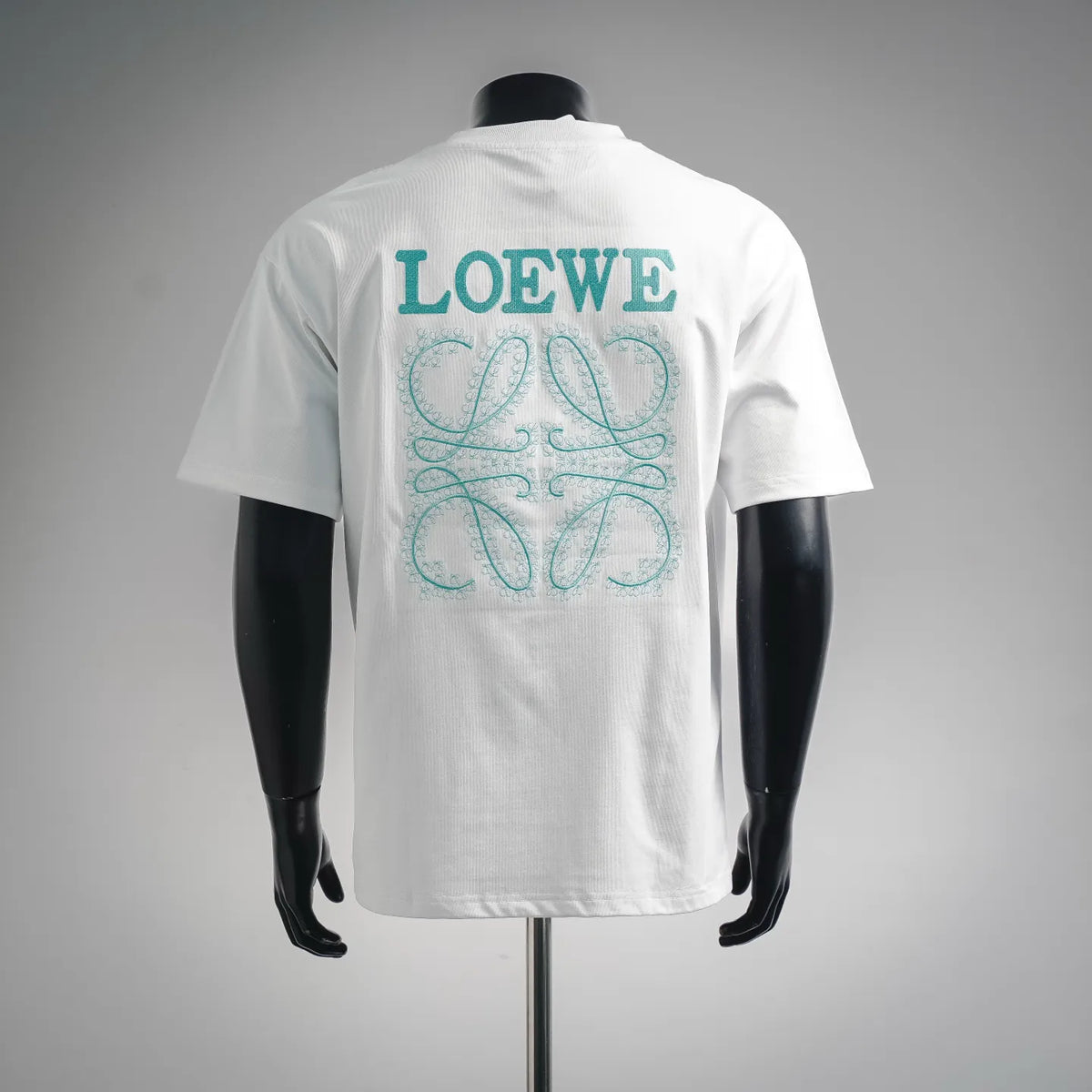 White short-sleeve T-shirt with large teal back graphic and LOEWE lettering