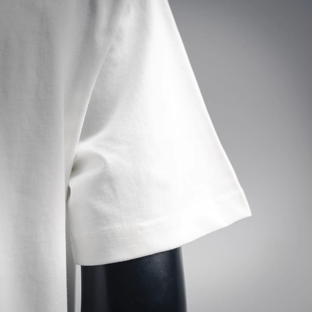 White T-shirt sleeve and side seam detail