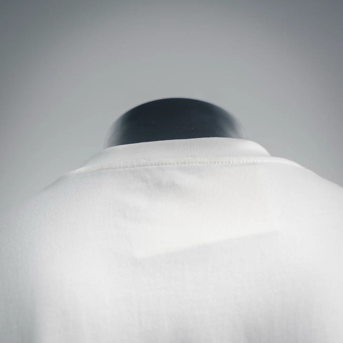 White T-shirt crew neckline and shoulder seam on mannequin
