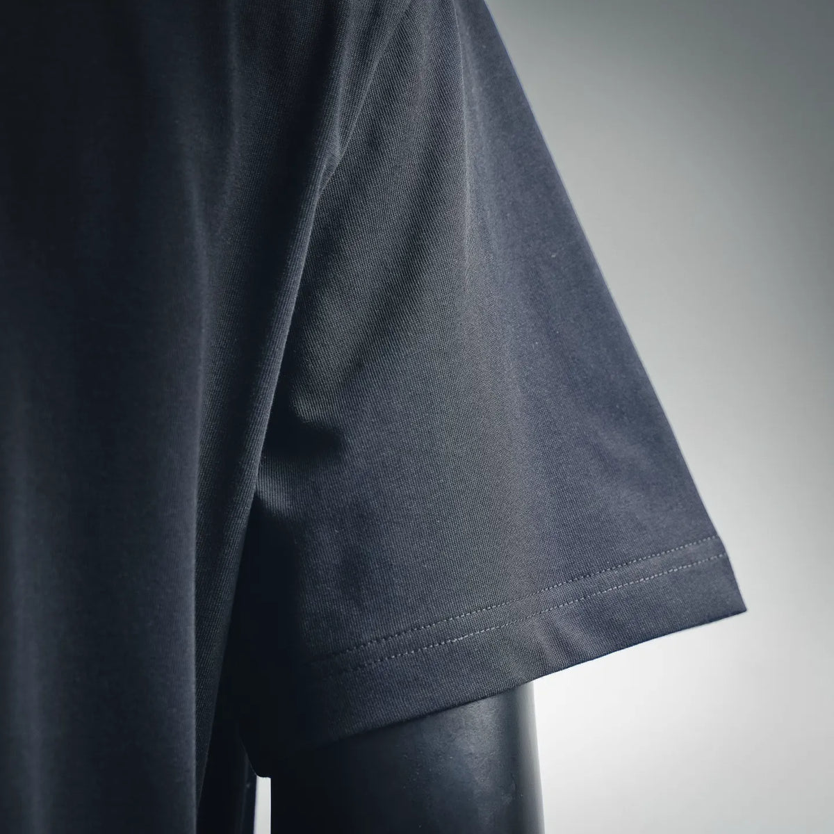 Dark navy short-sleeve t-shirt hem with double-stitched edge