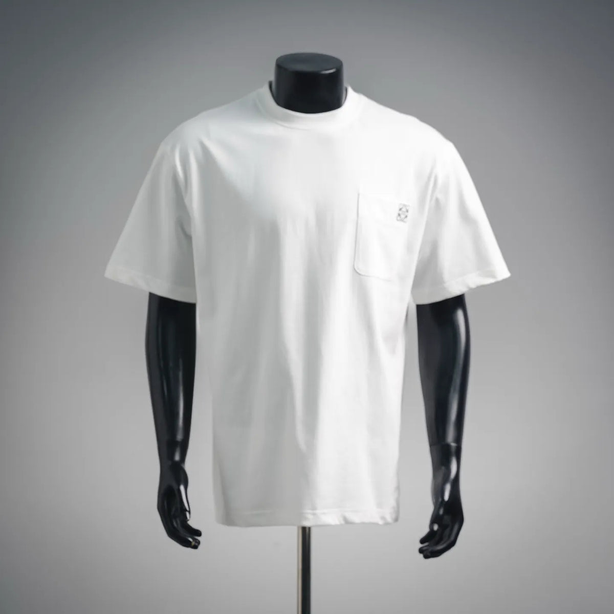 White short-sleeve T-shirt with crew neck and small chest pocket on mannequin