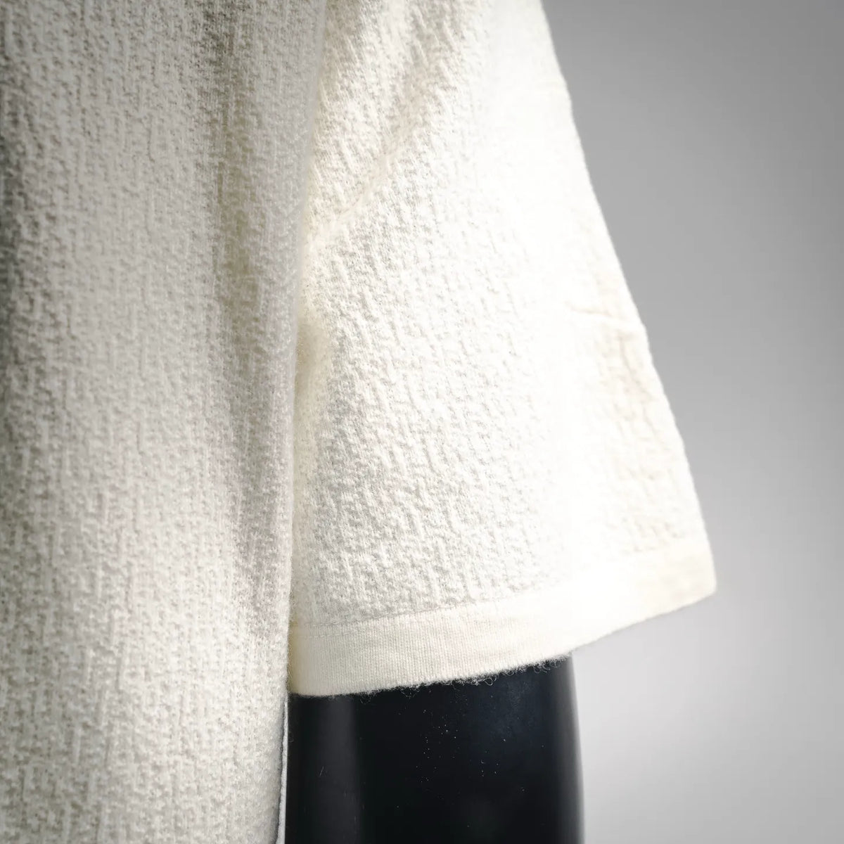 White short-sleeve shirt side view with straight hem