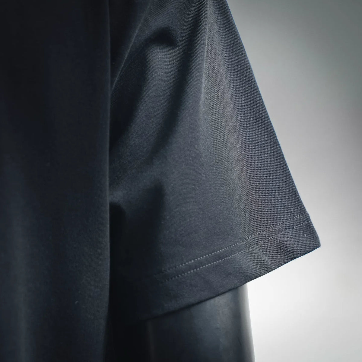 LOEWE dark T-shirt sleeve hem with neat double-stitch detailing