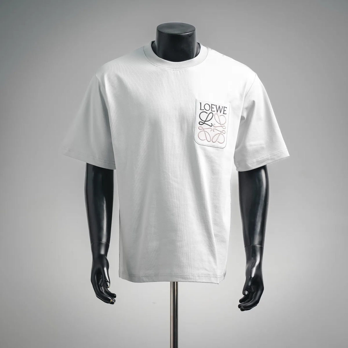 White LOEWE short-sleeve T-shirt with front square logo patch.