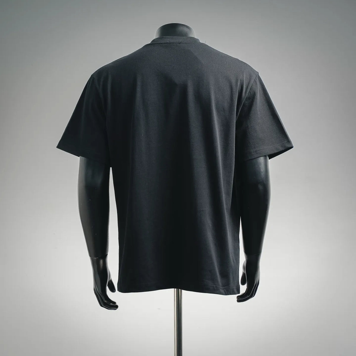 Black crew-neck T-shirt, plain back view on mannequin