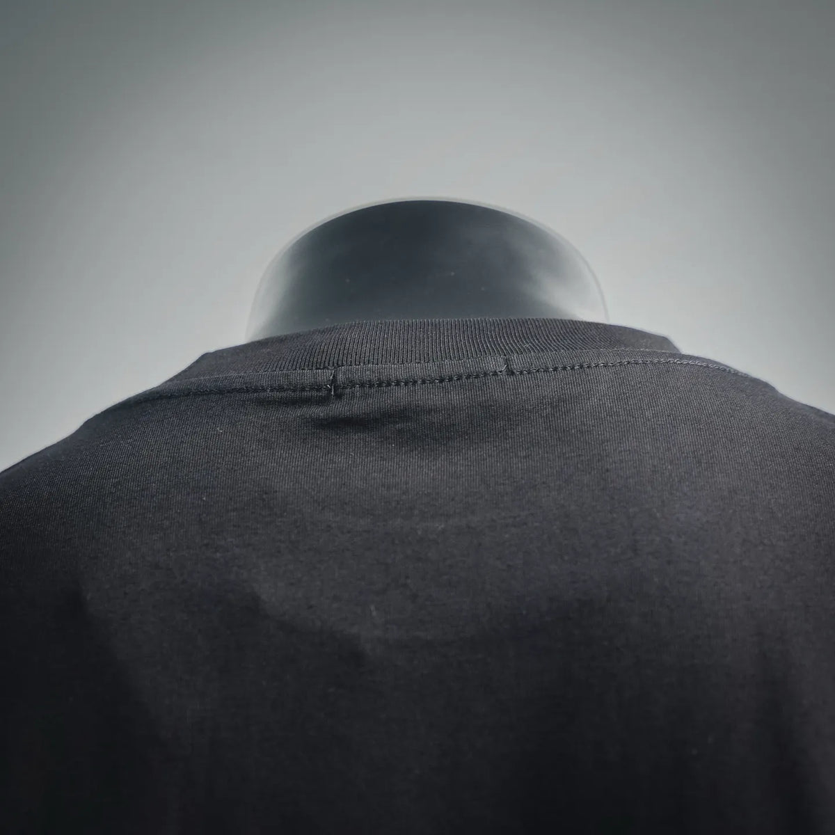 Black ribbed crew neck collar with stitched seam detail
