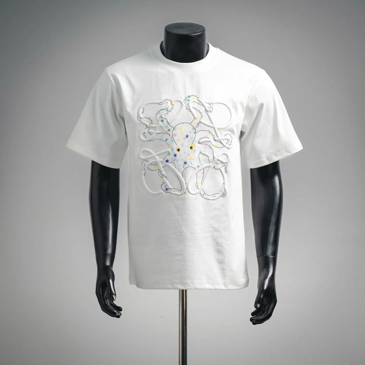 White LOEWE T-shirt with colorful graphic print of cartoon characters on the chest