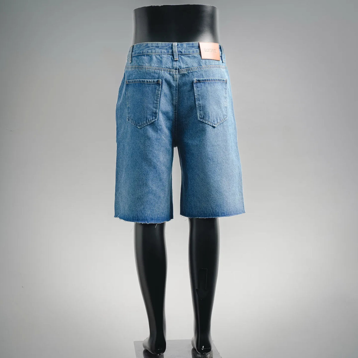 Light blue denim shorts with back pockets and straight hem