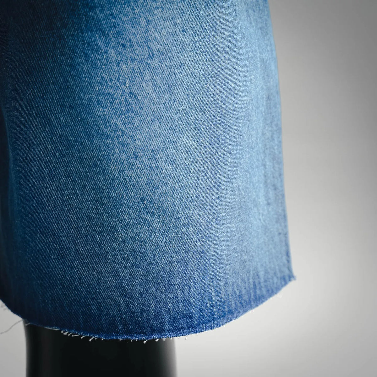 Light blue denim fabric close-up with textured weave