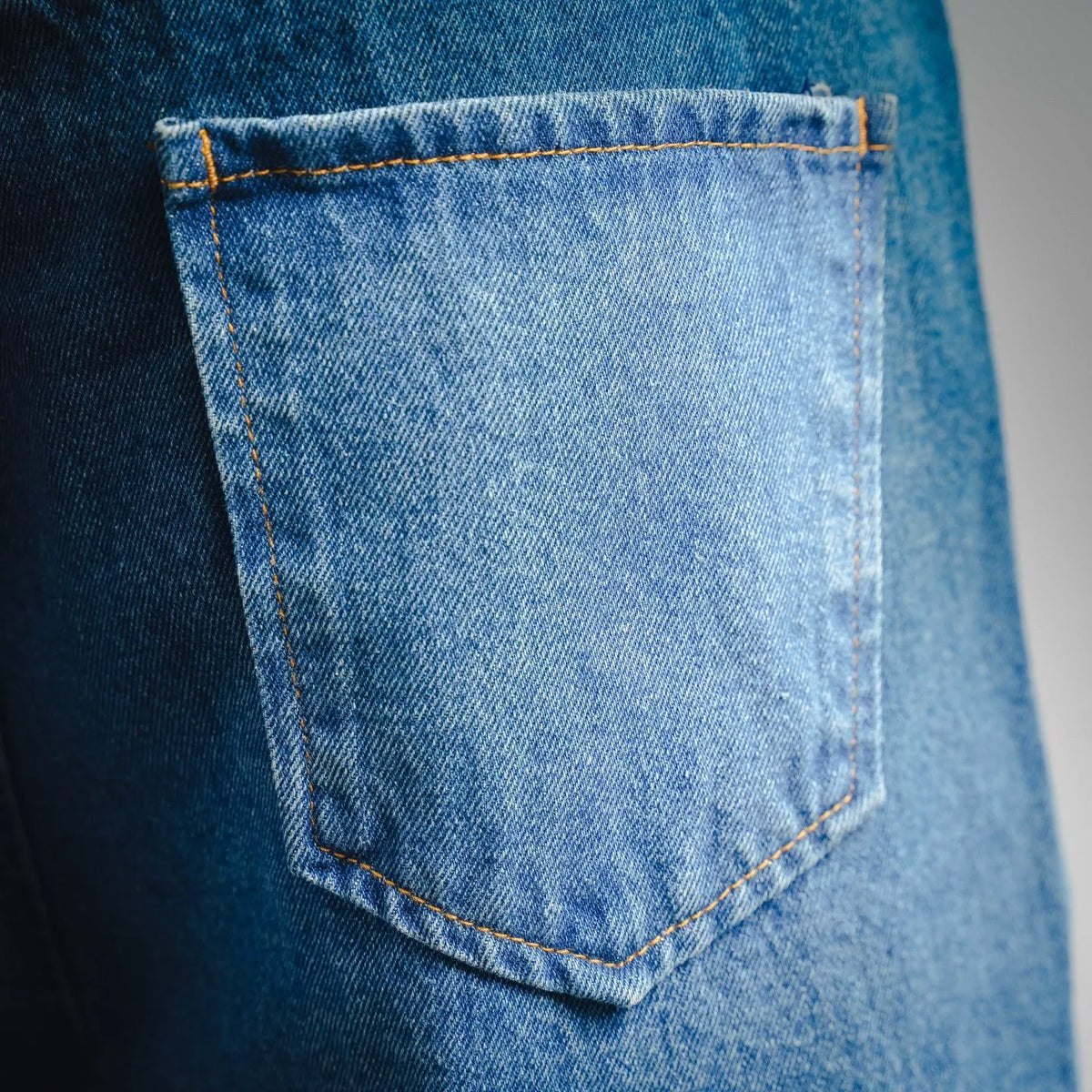 Light blue denim front pocket with contrast topstitching