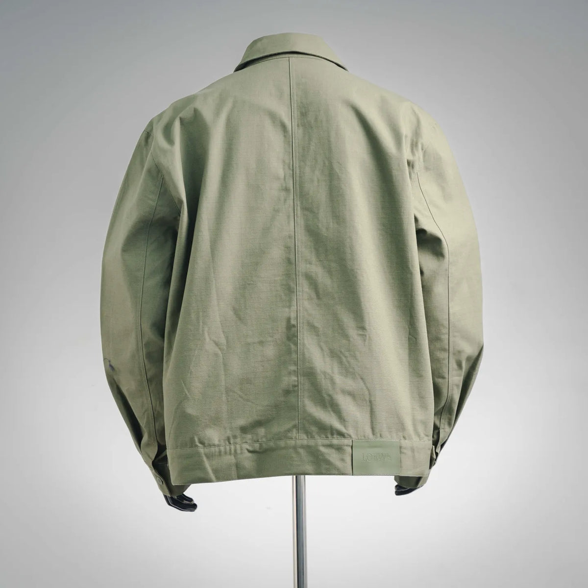 Olive green coat with gathered back yoke and full back seam line