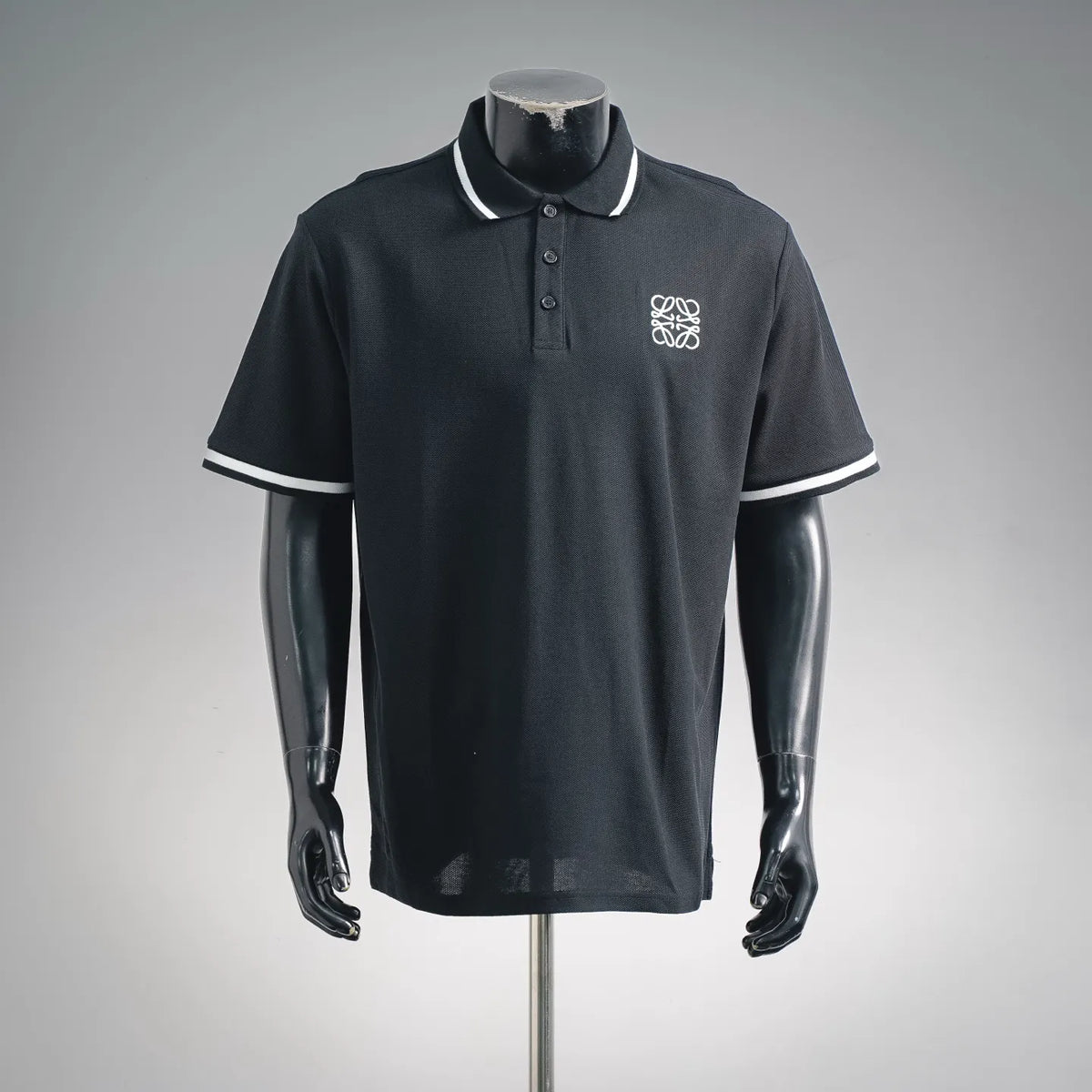 LOEWE short-sleeve polo shirt, dark with white-trim collar and embroidered crest logo