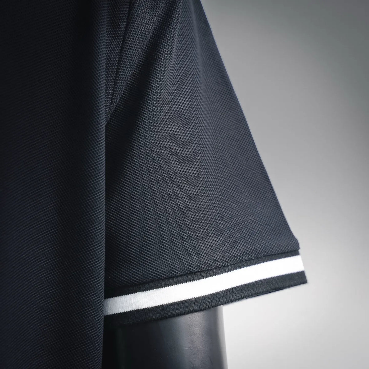 LOEWE polo shirt hem with white ribbed trim
