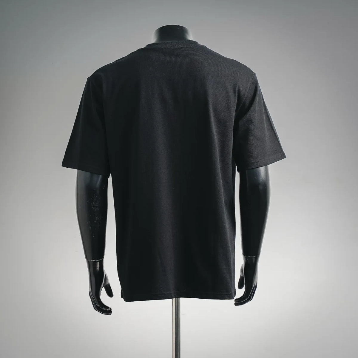 Black crewneck short-sleeve T-shirt, back view, plain design