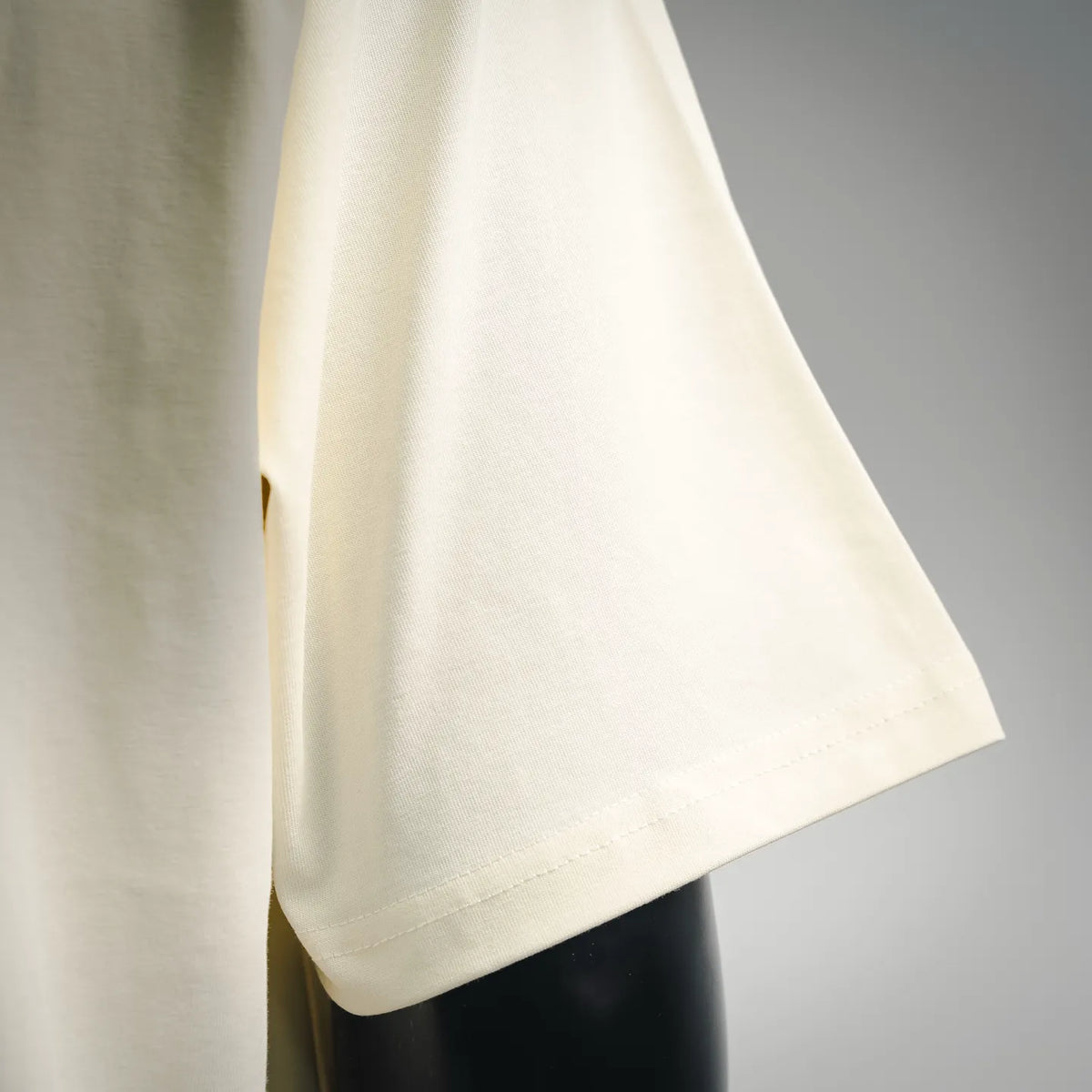 LOEWE cream T-shirt sleeve and side hem detail