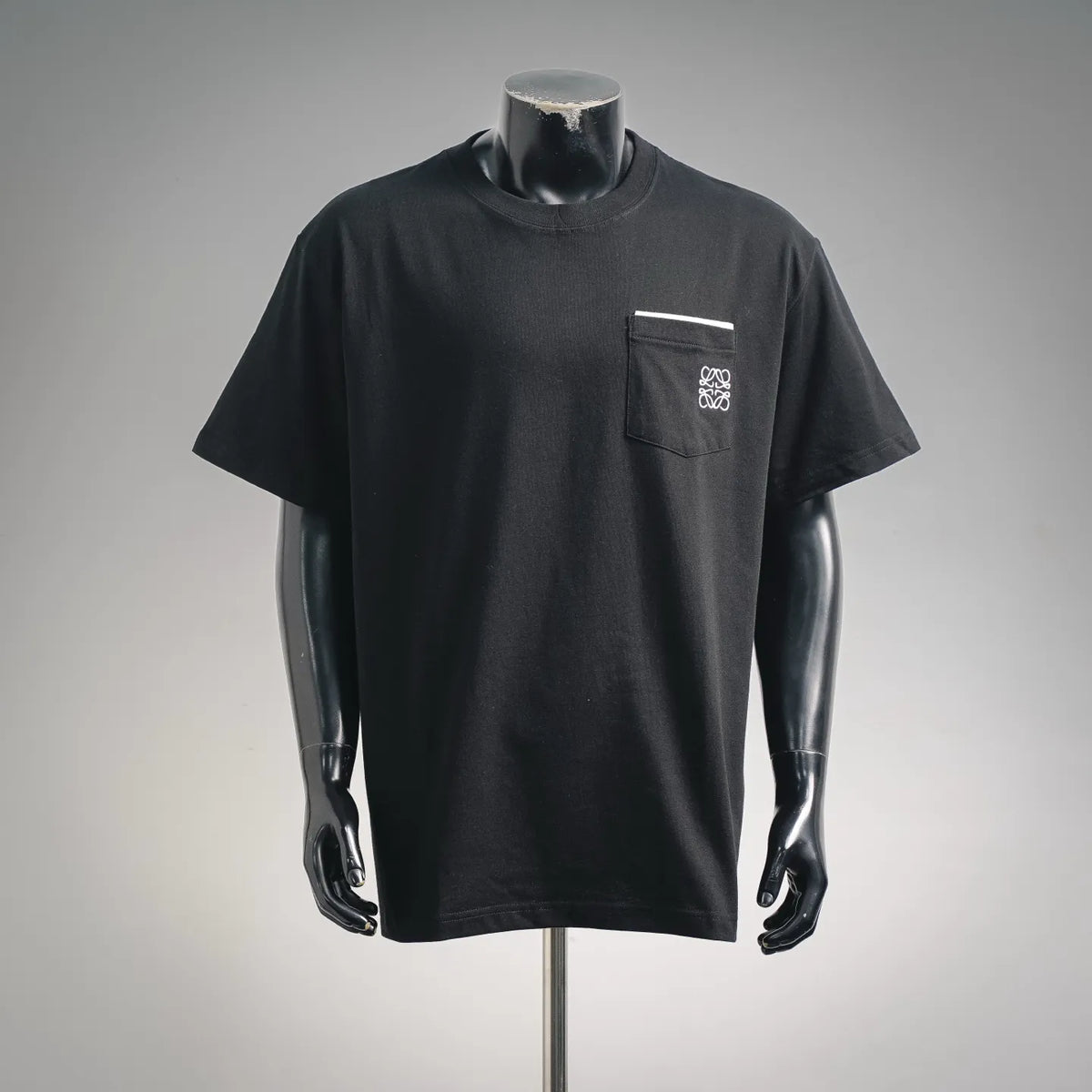Black short-sleeve T-shirt with high neck and chest pocket logo