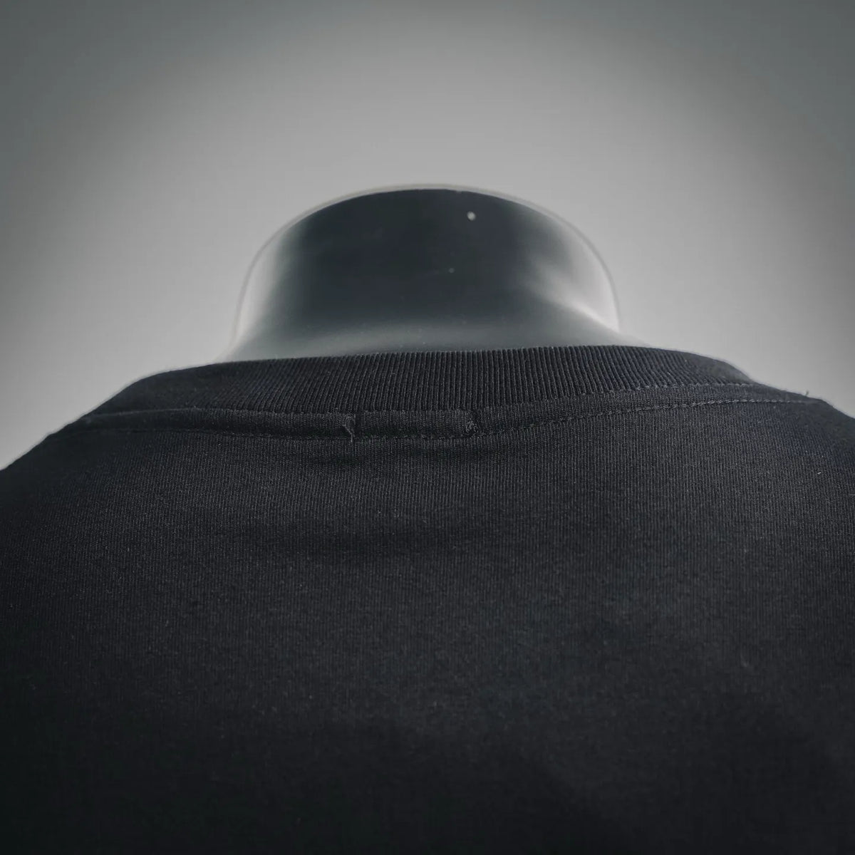 Black T-shirt collar and upper back close-up