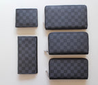 Louis Vuitton small zip wallets in dark checker pattern, set of four