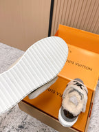 Louis Vuitton unisex sneakers, outsole view with white tread and gray upper with sherpa trim