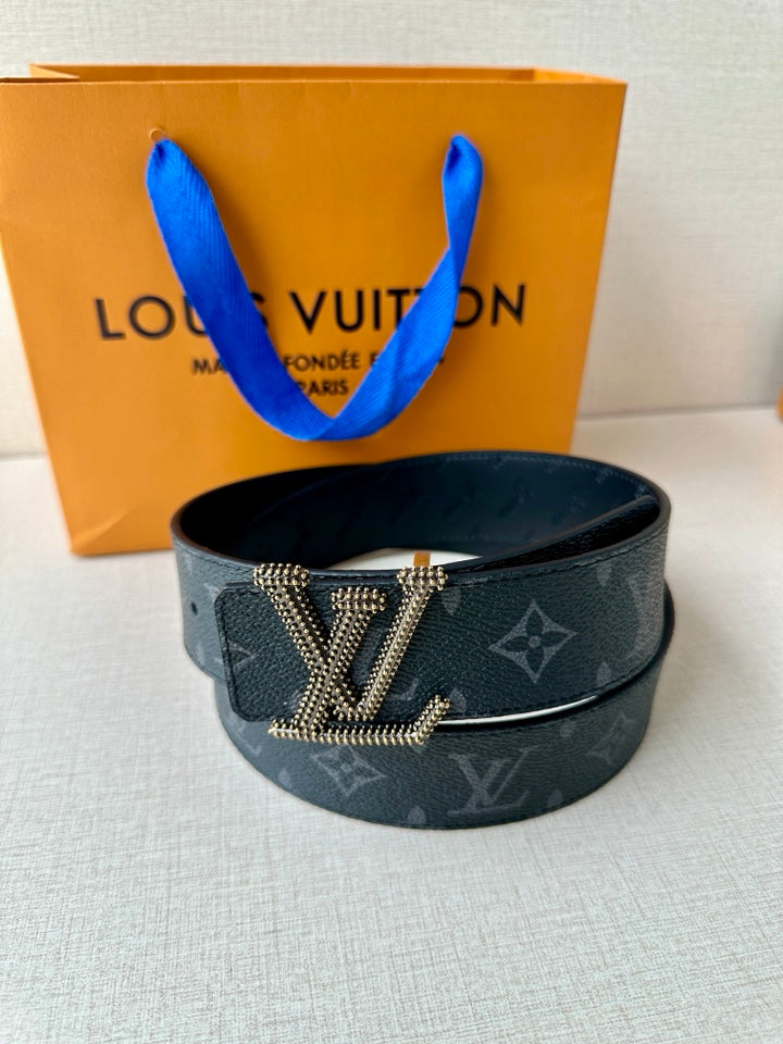 Louis Vuitton belt with dark blue monogram strap and centered LV rhinestone buckle