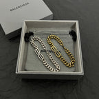 Two-tone chain bracelet set, gold and silver links with Balenciaga logo in box