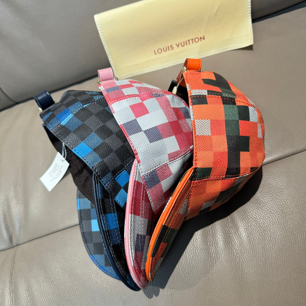 Louis Vuitton checkered caps set in blue, red, and orange with hanging tags