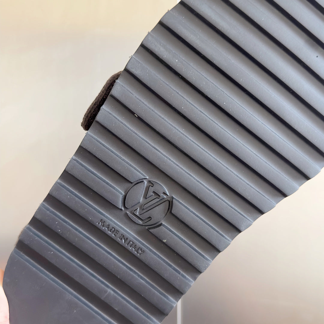 Louis Vuitton logo outsole with ridged rubber tread and embossed V logo