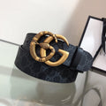 Gucci belt with dark monogram strap and gold double-G buckle