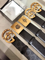 Black belt with textured gold buckle and ridged strap details