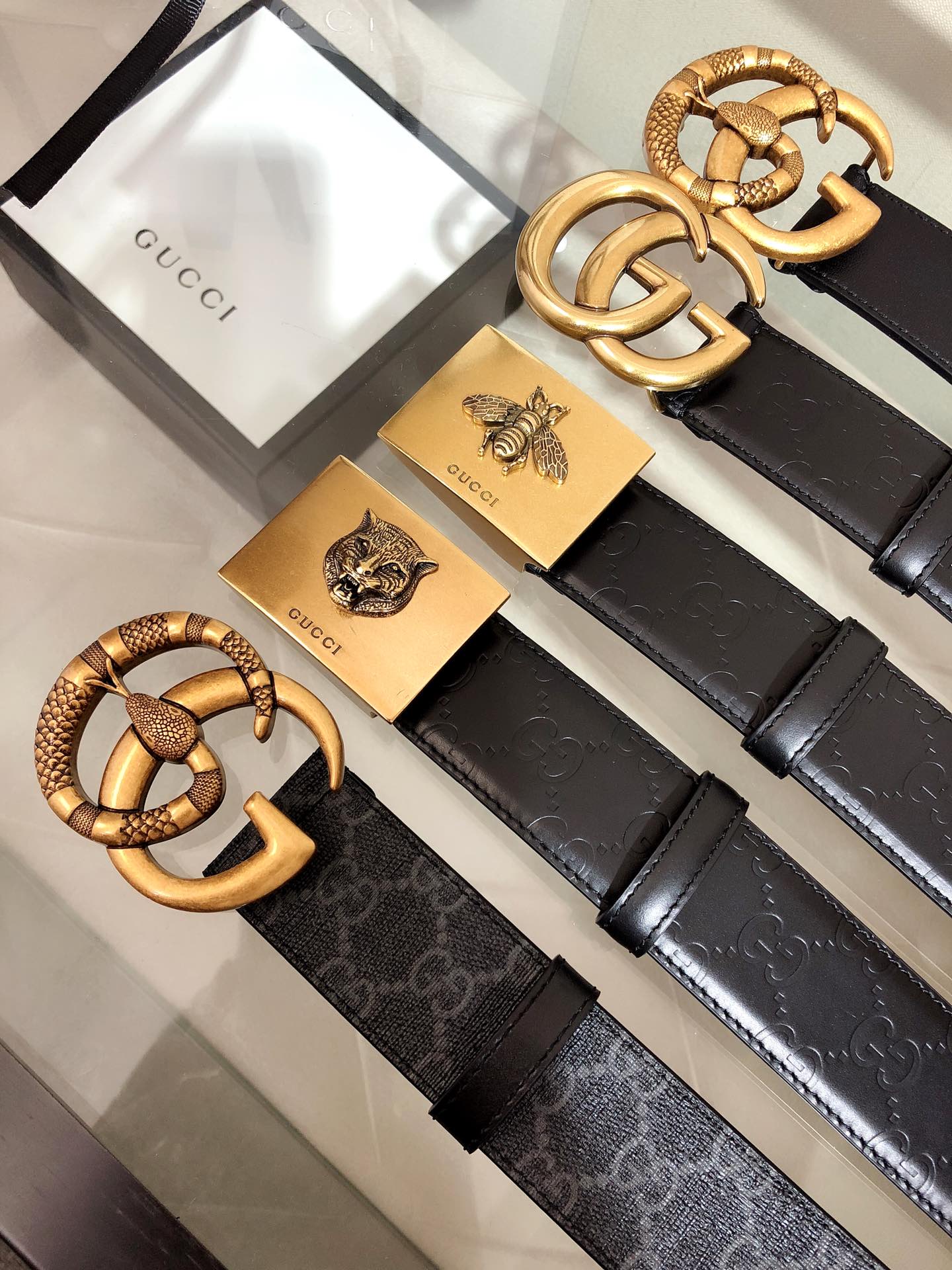 Black belt with textured gold buckle and ridged strap details