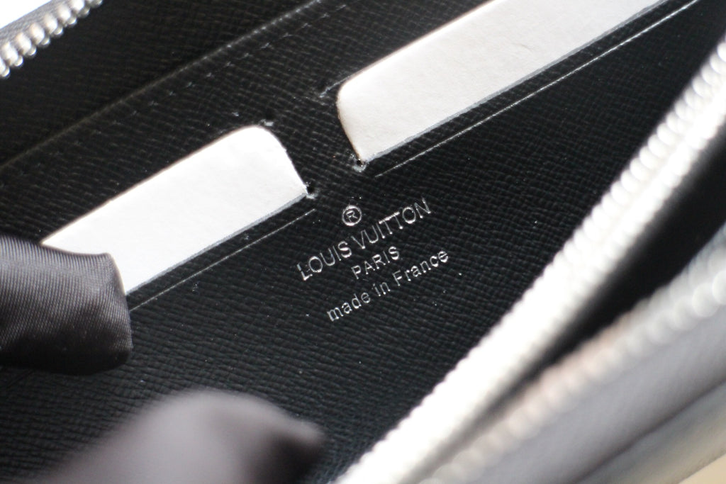 Dark leather wallet interior with Louis Vuitton logo and made in France stamp
