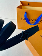 Louis Vuitton leather belt with dark blue strap and black star buckle