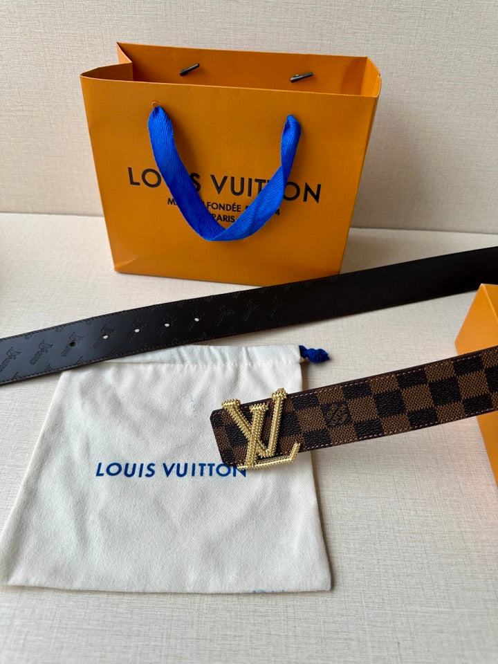 Louis Vuitton belt with Damier check strap and gold V buckle on white dust bag