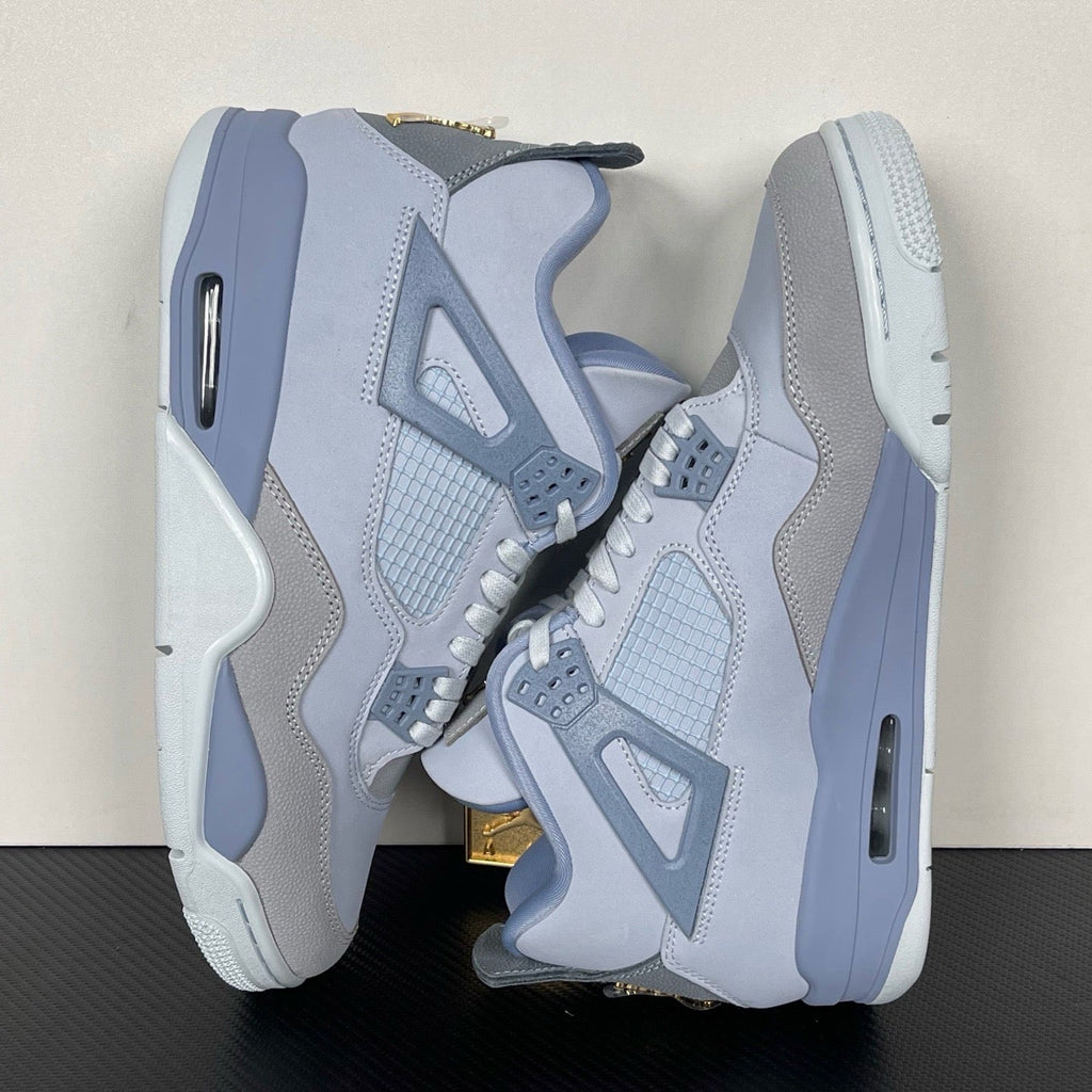 Light gray and blue basketball sneakers, front pair view with lace closure
