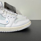 High-top sneakers close-up, white leather with light blue mesh and gray overlays, low profile sole