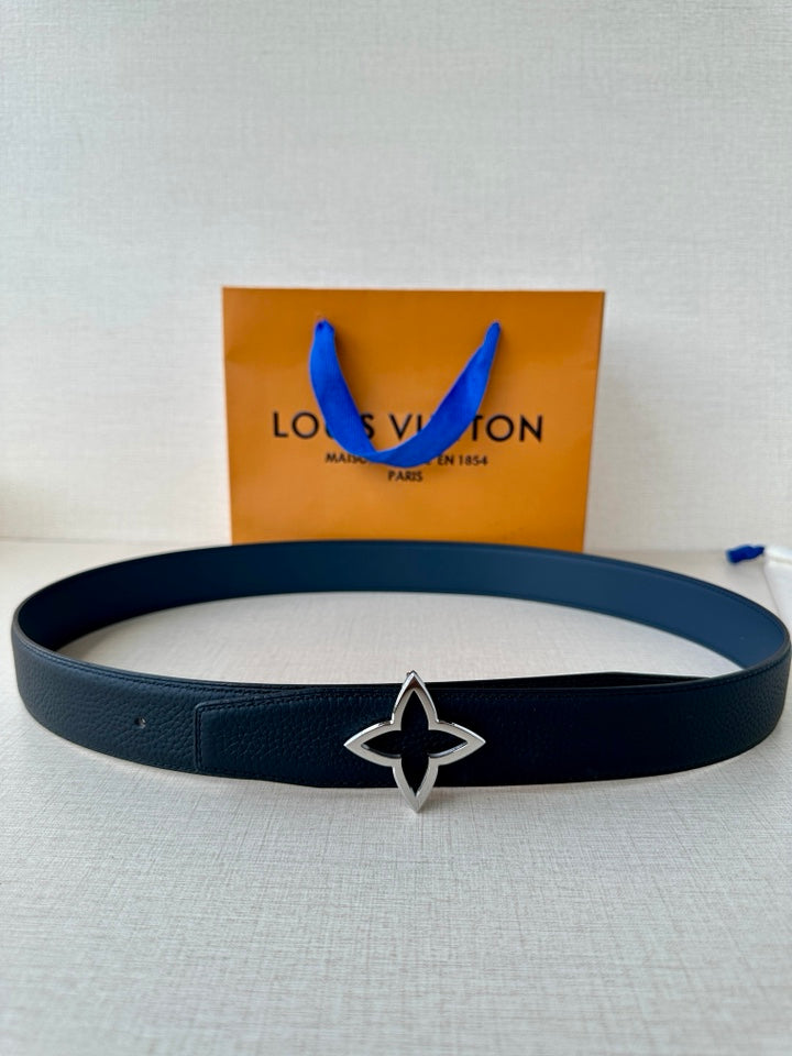Louis Vuitton leather belt in dark blue with silver-and-gold star buckle