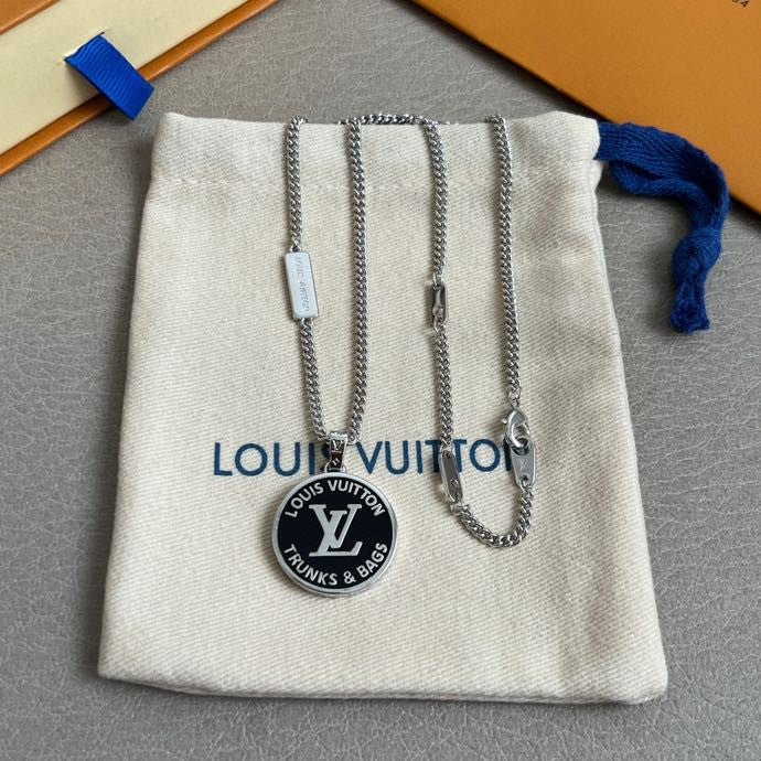 Louis Vuitton accessories pouch with silver chain necklaces and round Trunks & Bags charm